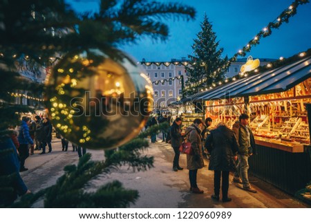 Salzburg Christmas Christkindl advent Market seen trough a Christmas tree branches Royalty-Free Stock Photo #1220960989