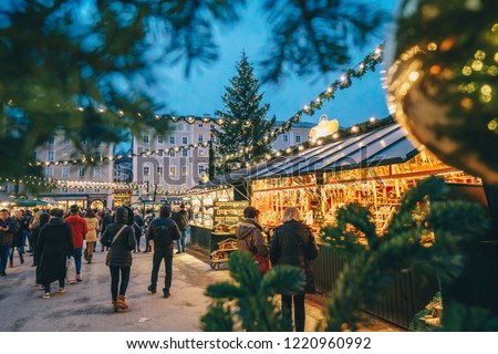 Salzburg Christmas Market seen trough a Christmas tree branches Royalty-Free Stock Photo #1220960992