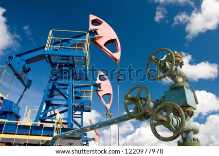 Oil and gas industry. Work of oil pump jack on a oil field. Oil latch