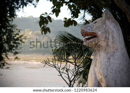 Lion statue overlooking Mekong river Luang Prabang Laos
