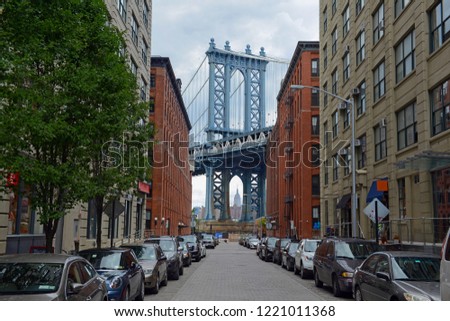 Manhattan Bridge and cobblestone street in Brooklyn New York