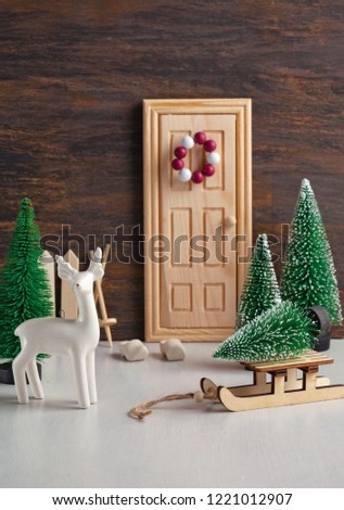Christmas background with miniature toys with wither scenes, seasonal Christmas, new year and winter decorations and gifts. 
