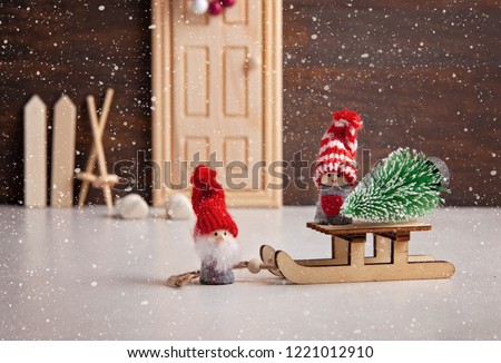 Christmas background with miniature toys with wither scenes, seasonal Christmas, new year and winter decorations and gifts. 
