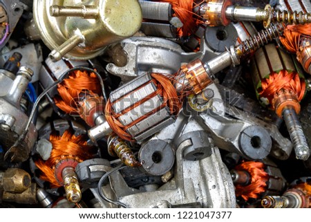 Electricity rotor parts was separated from defective fan motor for get removed a copper coil of motor to recycled, worked on industrial factory, on top view Royalty-Free Stock Photo #1221047377