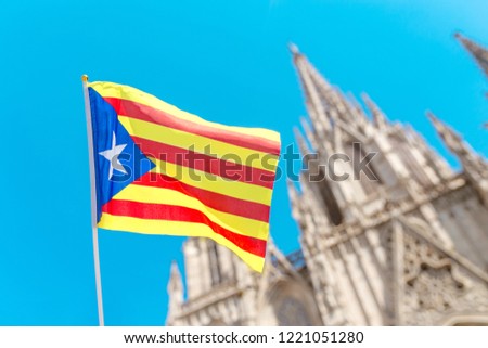 Catalan flag against Barcelona Cathedral Holy Cross and Saint Eulalia