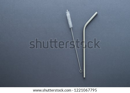 metal straw on gray background. flat lay top view. zero waste concept Royalty-Free Stock Photo #1221067795