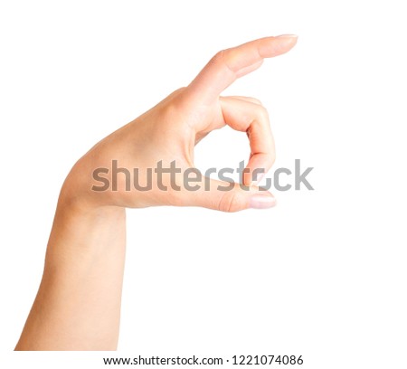 Female hand showing horns of animal or giving the devil horns gesture side view. Isolated with clipping path.