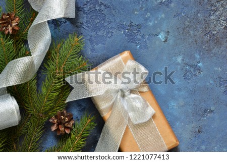 Christmas blue background with gift boxes and xmas tree. Christmas tree decoration and copy space for your text