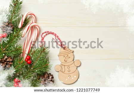 Christmas card with the decoration of the Xmas tree on a white background with a place for the text.