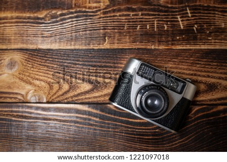 Vintage camera on a wooden table
