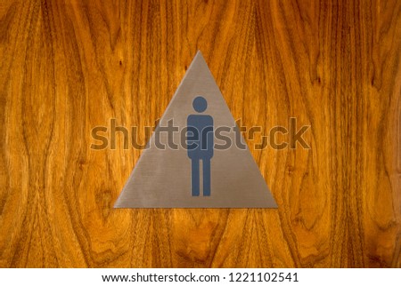 Men’s restroom sign with silhouette.