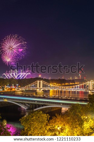 High view of the Chelsea Bridge in London from Battersea Park at night and the fireworks 