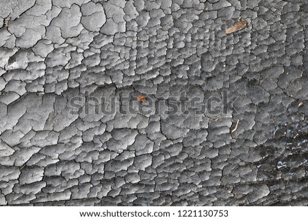 Old plastic background. The texture of old plastic. Weathered piece of plastic.
