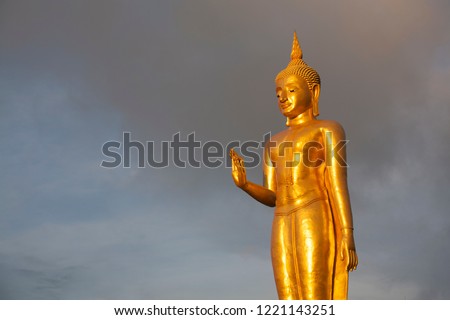 Buddha statue under the sky in the evening.