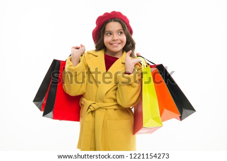 Nice purchase. Little shopper. Small girl with shopping bags. Small child with paper bags. Girl child enjoy shopping. Little shopaholic with paperbags. Shopping is an addiction.