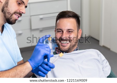 Man at beauty clinic. Platelet rich plasma ( PRP) therapy process. Royalty-Free Stock Photo #1221169009
