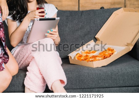 nice brunette girl with tablet lying on the floor