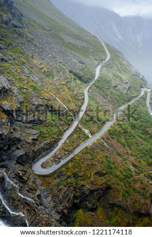 spellbinding landscape of Norwegian nature roads among high charming mountains and hills in which it is impossible not to fall in love imprinted on photos of traveler