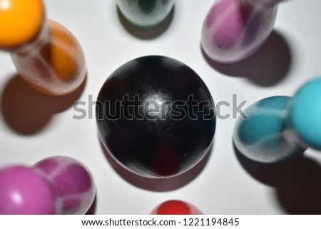 Close up photos of Bowling balls and bowling pins