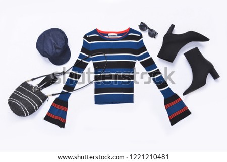 striped colorful sweater with black boots, handbag ,hat, sunglasses ,hat on white background
