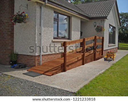 Wheelchair Ramp fitted to front of home 2a Royalty-Free Stock Photo #1221233818