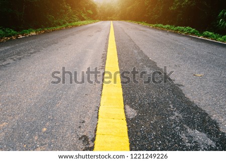 Road in with nature forest and foggy road  of Rain forest.
