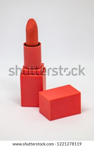 Red lipstick on white background. Isolated Photo.