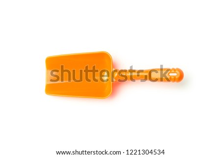 Children's plastic orange scoop isolated on white