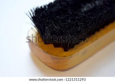 Close-up shoe polish brush isolated on a white background.