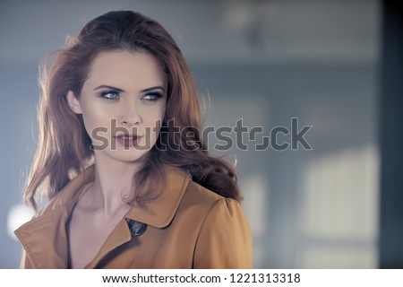 A film scene with a mysterious woman in a coat