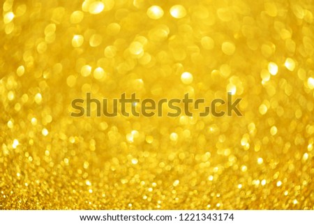 Glitter defocused abstract background with blurry lights, stars. Christmas festive texture. New year party.
