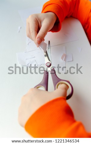 the children will work with scissors and colored paper