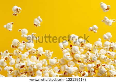 Close-Up Of Popcorn Against Yellow Background Royalty-Free Stock Photo #1221386179