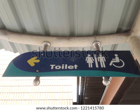 Toilet sign for women, men, and handicapped.