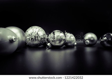 Cool holidays wallpaper background of Christmas decorations and balls or baubles on black background.