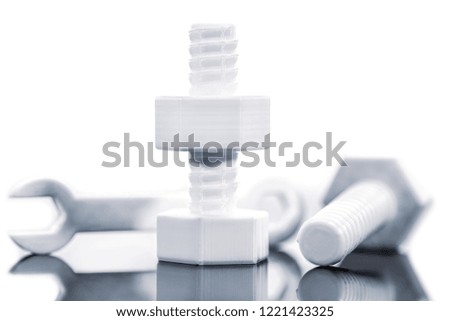 Hexagon screw and wrench of filament printed with reflection in front of white background