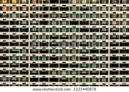 A background of windows of a skyscraper.