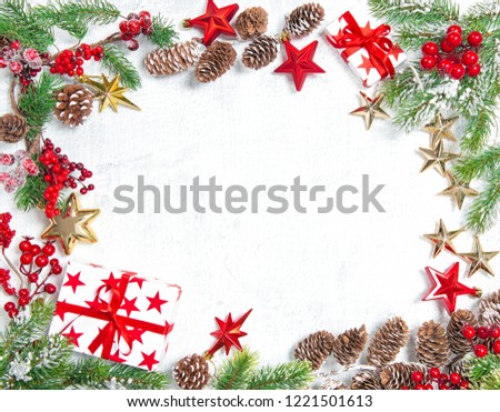 Christmas tree branches with gifts, stars, red gold decorations on white background