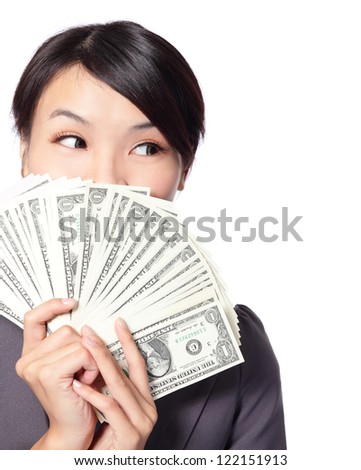 close up portrait of happy business Woman Holding Money and look to empty copy space isolated on white background, model is a asian beauty
