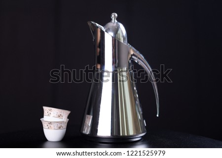 arabic coffee pot isolated on black background 