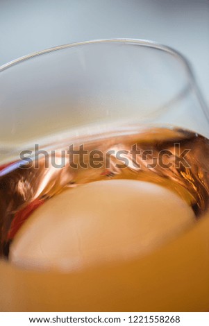 detail of glass with wine, glass and dew drops, white wine in gold, celebration of the new year, toast of celebrations and events