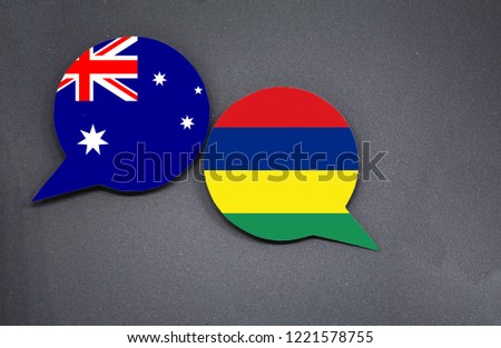Australia and Mauritius flags with two speech bubbles on dark gray background