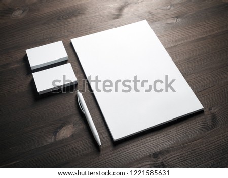Blank corporate stationery set on wooden background. Template for branding ID.