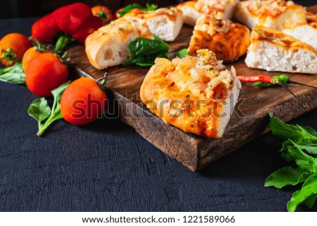 Hot pizza on wooden tray for pizza