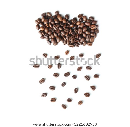 Creative composition with roasted coffee beans on white background