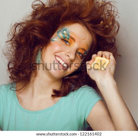 woman with creative make up and lime