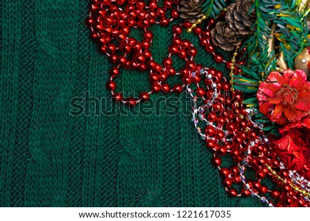 Xmas background with red decoration, green branch with copy space