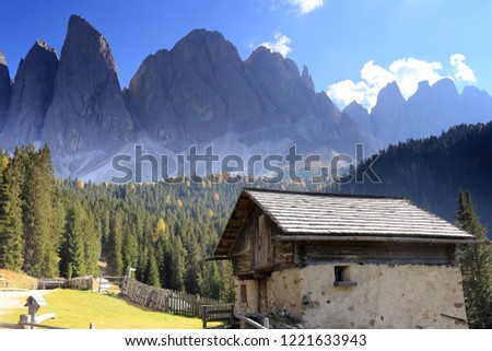 beautiful mountain landscape with old lodge in italy
