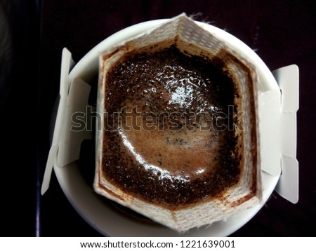 Instant freshly brewed cup of coffee,Drip bag fresh coffee Royalty-Free Stock Photo #1221639001