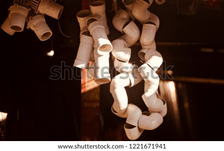 Hanging plastic pipes around a shop unique photo